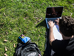 Photo of a student with a laptop