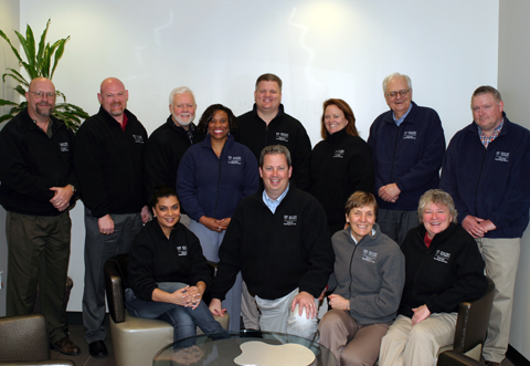 Photo of the PMO team in their new matching jackets.